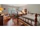 Comfortable bedroom with two beds, hardwood floors, and natural light at 3040 Valencia Ter, Charlotte, NC 28211