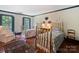 Bedroom features two beds, hardwood floors, and natural light at 3040 Valencia Ter, Charlotte, NC 28211
