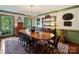 Formal dining room with hardwood floors, chandelier, and a traditional hutch at 3040 Valencia Ter, Charlotte, NC 28211