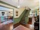 Grand foyer with hardwood floors, staircase, and views into the formal dining and living areas at 3040 Valencia Ter, Charlotte, NC 28211