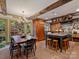 Spacious kitchen with brick flooring, wooden cabinetry, a large island, and a breakfast nook at 3040 Valencia Ter, Charlotte, NC 28211