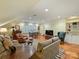 Spacious living area with ample seating, wooden floors, and a light-filled atmosphere at 3040 Valencia Ter, Charlotte, NC 28211