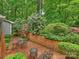 Inviting patio area surrounded by greenery and blooming flowers, perfect for relaxation at 3040 Valencia Ter, Charlotte, NC 28211