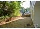 Backyard of home featuring lush greenery, landscape and serene outdoor space at 307 N Catawba St, Lancaster, SC 29720