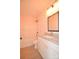 Bathroom with white vanity, granite countertop and tile floor adjacent to a shower tub combination at 307 N Catawba St, Lancaster, SC 29720