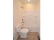 This bathroom features black fixtures, a bathtub/shower combination and a white toilet and flooring at 307 N Catawba St, Lancaster, SC 29720