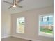 This bedroom features hardwood floors, ceiling fan and two windows overlooking the backyard at 307 N Catawba St, Lancaster, SC 29720