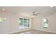 Bright living room featuring a ceiling fan, recessed lighting and a door leading to the backyard at 307 N Catawba St, Lancaster, SC 29720