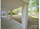 A covered porch with white brick columns offers a cool outdoor living space at 307 N Catawba St, Lancaster, SC 29720