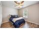 Cozy bedroom with wood floors and a ceiling fan, filled with soft natural light at 311 Masters Dr, Rock Hill, SC 29732