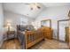 Charming bedroom featuring wood floors, a vaulted ceiling, and natural wood furnishings at 311 Masters Dr, Rock Hill, SC 29732