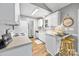 Bright kitchen featuring white cabinets, modern appliances, and a breakfast bar with stool seating at 311 Masters Dr, Rock Hill, SC 29732