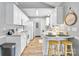 Charming kitchen with white cabinetry, modern appliances, and a cozy breakfast bar area at 311 Masters Dr, Rock Hill, SC 29732
