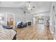 Spacious living room with vaulted ceilings, a fireplace, and seamless flow into the dining area and kitchen at 311 Masters Dr, Rock Hill, SC 29732