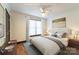 Comfortable bedroom with neutral decor, ceiling fan, and a large window, virtually staged for a cozy appeal at 3150 Driftwood Dr # B, Charlotte, NC 28205