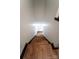 Long staircase features wood treads and white risers, accented with black trim, leading to the upper level at 3150 Driftwood Dr # B, Charlotte, NC 28205