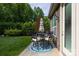 Backyard patio with a dining table and chairs near the home at 3186 Helmsley Ct, Concord, NC 28027