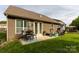 Backyard featuring a patio set with a dining table at 3186 Helmsley Ct, Concord, NC 28027