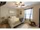 Comfortable bedroom with cozy décor, featuring a well-lit window and neutral color scheme at 3186 Helmsley Ct, Concord, NC 28027