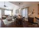 Dining area with pendant lighting and open to the living room offers a seamless living experience at 3186 Helmsley Ct, Concord, NC 28027