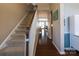 Inviting entryway features hardwood floors, a staircase, and a view into the living spaces at 3186 Helmsley Ct, Concord, NC 28027