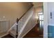 Inviting entryway features hardwood floors, a staircase, and a view into the living spaces at 3186 Helmsley Ct, Concord, NC 28027
