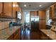 Charming kitchen featuring ample cabinetry, granite countertops, and stainless steel appliances at 3186 Helmsley Ct, Concord, NC 28027
