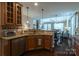 Well-appointed kitchen with granite countertops seamlessly connects to the dining and living spaces at 3186 Helmsley Ct, Concord, NC 28027