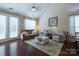 Bright living room with vaulted ceiling, plush seating, and stylish decor, perfect for relaxation at 3186 Helmsley Ct, Concord, NC 28027
