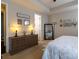 Bedroom showcasing dresser, full-length mirror, and stylish décor; perfect for relaxation at 3186 Helmsley Ct, Concord, NC 28027