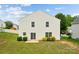 Back exterior view of home showing grassy lawn, sliding glass doors and vinyl siding at 3512 Gibbon Terrace Ct, Charlotte, NC 28269