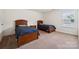 Comfortable bedroom featuring carpet, twin beds with wooden frames, and natural light at 3512 Gibbon Terrace Ct, Charlotte, NC 28269