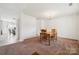 Cozy dining room featuring a wooden table with four chairs, carpet, and a chandelier at 3512 Gibbon Terrace Ct, Charlotte, NC 28269