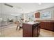 Open kitchen and living area with island and stainless steel appliances at 3512 Gibbon Terrace Ct, Charlotte, NC 28269