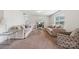 Bright living room featuring modern sofas, a glass coffee table, a TV on the wall and an open floor plan at 3512 Gibbon Terrace Ct, Charlotte, NC 28269