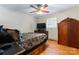 Bedroom showcasing hardwood floors, a ceiling fan, and furniture, creating a cozy and inviting space at 393 Carson Dr, Gastonia, NC 28052