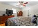 Bedroom showcasing hardwood floors, a ceiling fan, and furniture, creating a cozy and inviting space at 393 Carson Dr, Gastonia, NC 28052