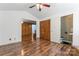 Bedroom features a ceiling fan, and wood-look floors at 393 Carson Dr, Gastonia, NC 28052
