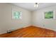 Bedroom features hardwood floors and two windows at 393 Carson Dr, Gastonia, NC 28052