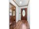 Elegant foyer featuring wood floors, decorative glass doors, and a welcoming front door at 393 Carson Dr, Gastonia, NC 28052
