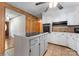 Bright kitchen featuring white cabinets, a center island, and access to a dining area at 393 Carson Dr, Gastonia, NC 28052