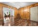 Living room features wood-paneled walls and hardwood floors at 393 Carson Dr, Gastonia, NC 28052