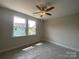 This bedroom features natural light, ceiling fan, and neutral walls at 412 Nathaniel Way # Brx0052, Charlotte, NC 28213