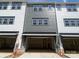 Spacious two-car garage with gray siding in a modernly designed townhome complex at 412 Nathaniel Way # Brx0052, Charlotte, NC 28213