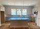 Bright kitchen features gray cabinetry, modern lighting fixtures, and a functional island at 412 Nathaniel Way # Brx0052, Charlotte, NC 28213