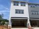 Spacious two-car garage showcasing modern design and ample storage space for vehicles and equipment at 416 Nathaniel Way # Brx0051, Charlotte, NC 28213