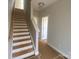 Hallway and staircase, offering a glimpse of the home's layout and potential for customization at 416 Nathaniel Way # Brx0051, Charlotte, NC 28213
