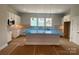 Modern kitchen with a large island, white cabinetry, and stainless steel appliances at 416 Nathaniel Way # Brx0051, Charlotte, NC 28213