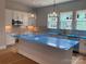 Spacious kitchen with island, pendant lighting, and modern appliances, perfect for cooking and entertaining at 416 Nathaniel Way # Brx0051, Charlotte, NC 28213