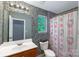 Cute bathroom featuring a white vanity, mosaic tile accent wall, and Hello Kitty shower curtain at 4332 Bathurst Dr, Charlotte, NC 28227